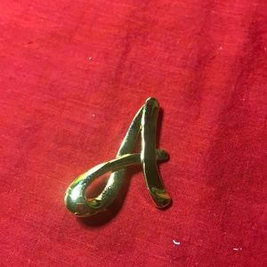 Beautiful complement to you suit, scarf or top